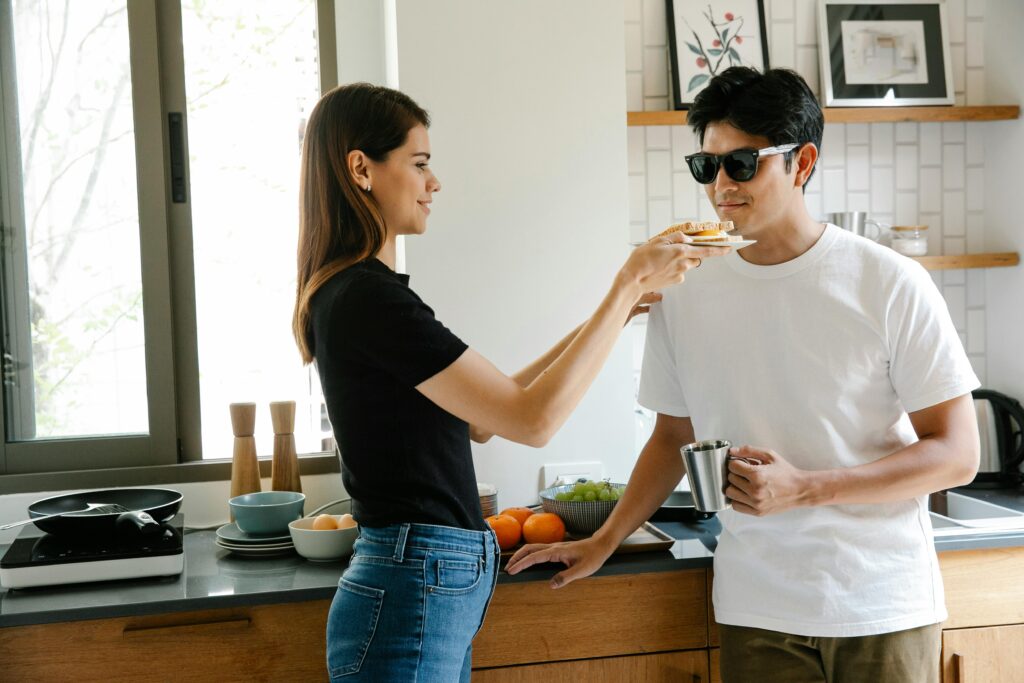 pexels-photo-7188712-7188712 A smiling couple shares breakfast in a cozy kitchen, highlighting love and care.